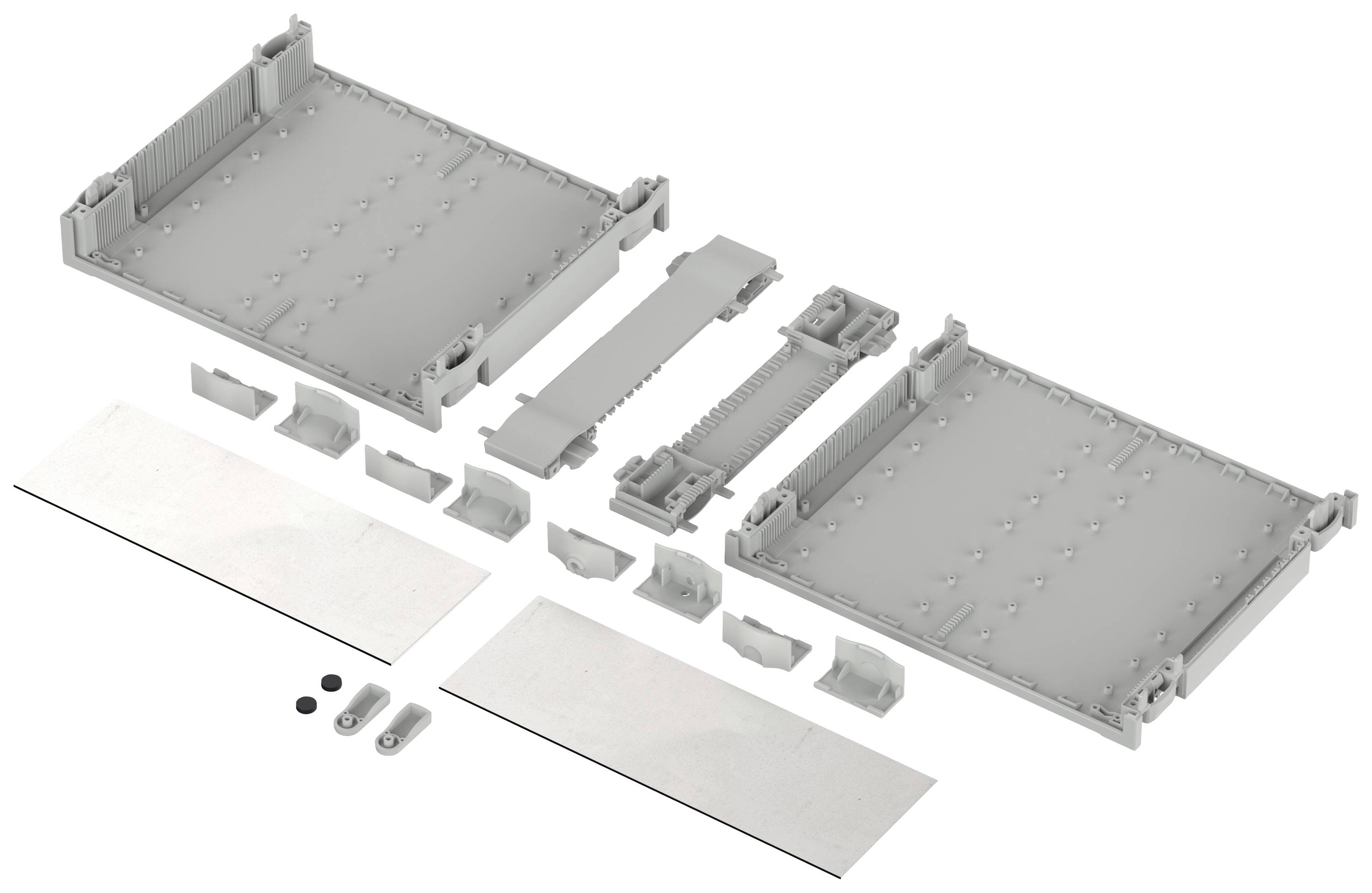 Disassembled parts of a housing system, comprising two large rectangular components and several smaller connecting pieces.