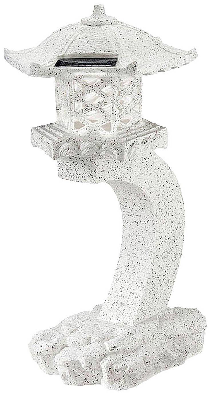 A small, curved lantern in Japanese style, crafted from light, speckled stone, resting on a broad base.