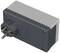 A rectangular, grey plug adapter with two round pins.