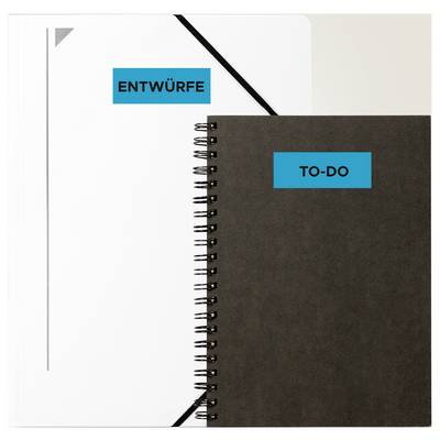 Two spiral-bound notebooks, on the left white with label 'DRAFTS', on the right dark with label 'TO-DO', arranged side by side overlapping.