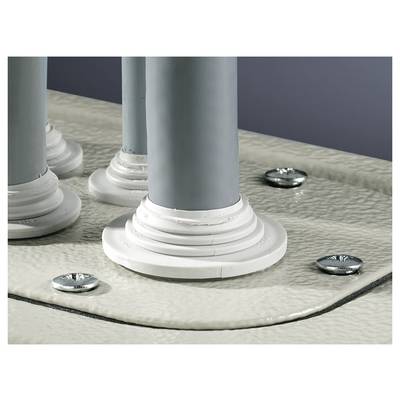 Grey pipes with white seals protrude from a metallic surface. Screws secure the seals. Industrial environment.