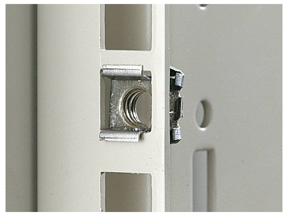 Nut in a shelf bracket, ready for installation in a metal shelving system.