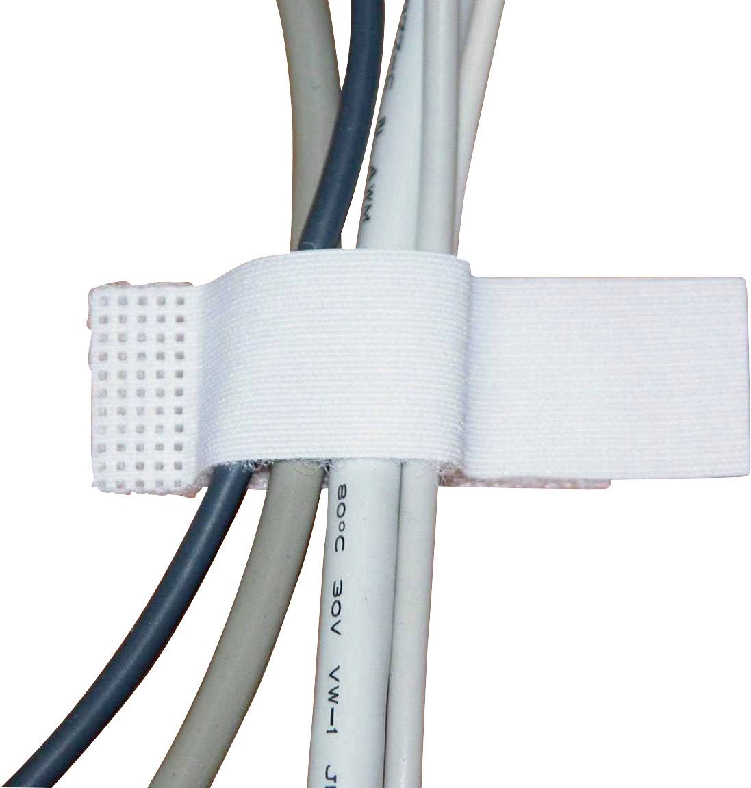 Several cables are bundled together with a white hook and loop fastener.