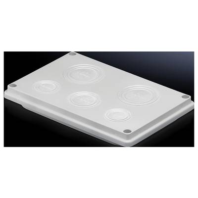 A white lid with four round protrusions rests on a dark surface.