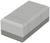A grey eraser with bevelled edges rests on an indeterminate surface.