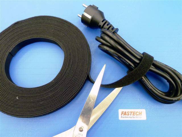 A roll of hook and loop fastener, a pair of scissors, and a bundled network cable on a blue background.
