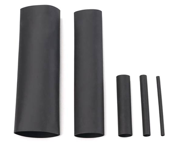 Five black heat shrink tubes of varying sizes arranged from largest to smallest in order, aligned horizontally on a white background.