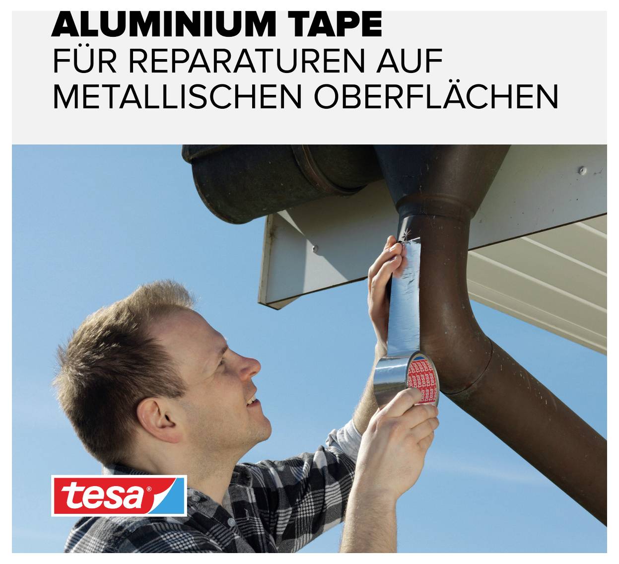A man is attaching tesa aluminium tape to a downpipe beneath a roof. Text: 'Aluminium Tape for repairs on metallic surfaces'.