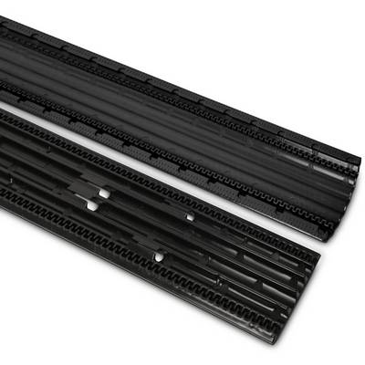 Two black plastic components, likely structural parts, are lying parallel to each other.