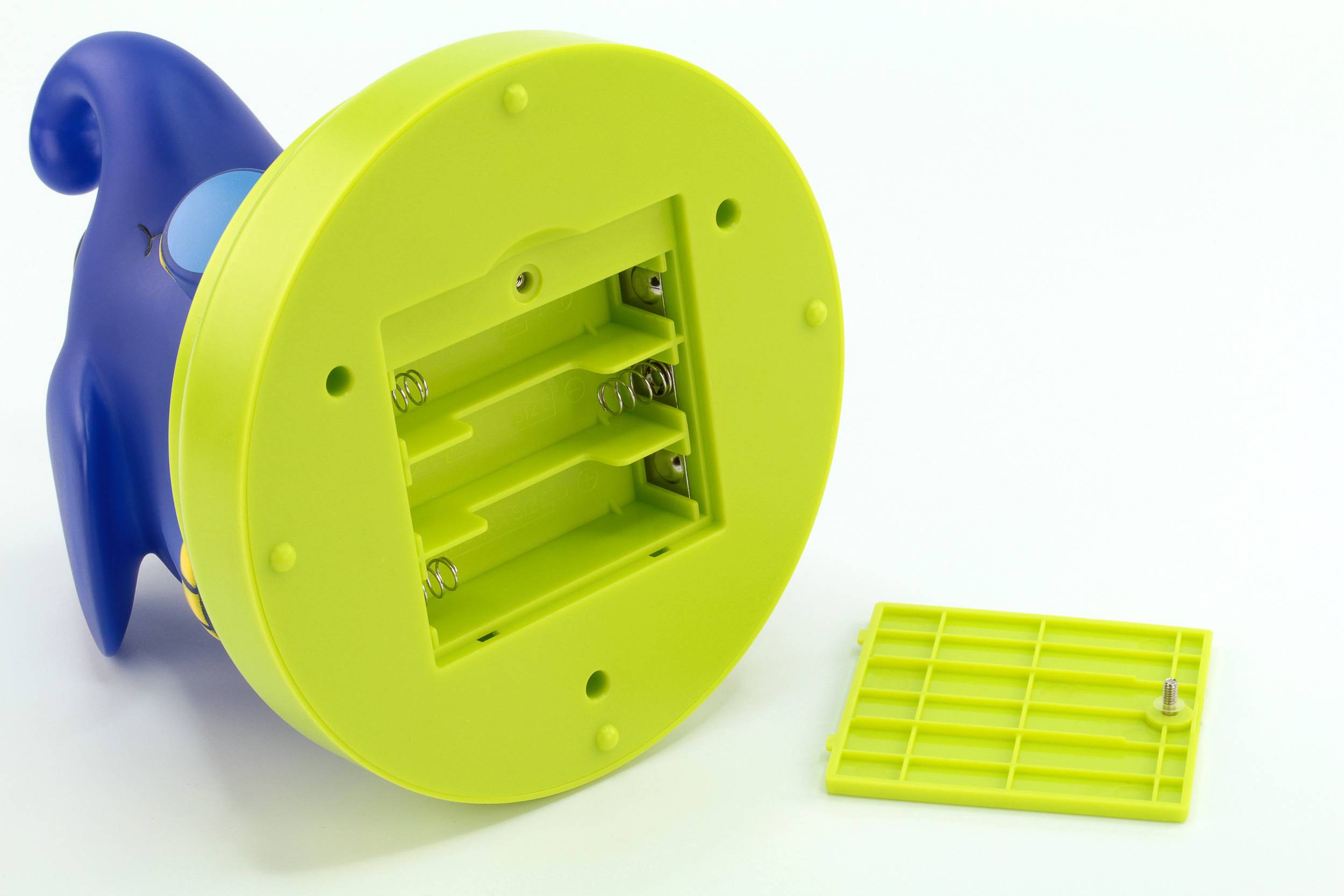 Toy with battery compartment open. Batteries missing. The compartment has space for three AA batteries. Cover and screw beside it.