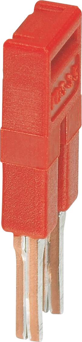 A red electronic jumper cap with dual metal prongs, used for establishing connections on circuit boards.