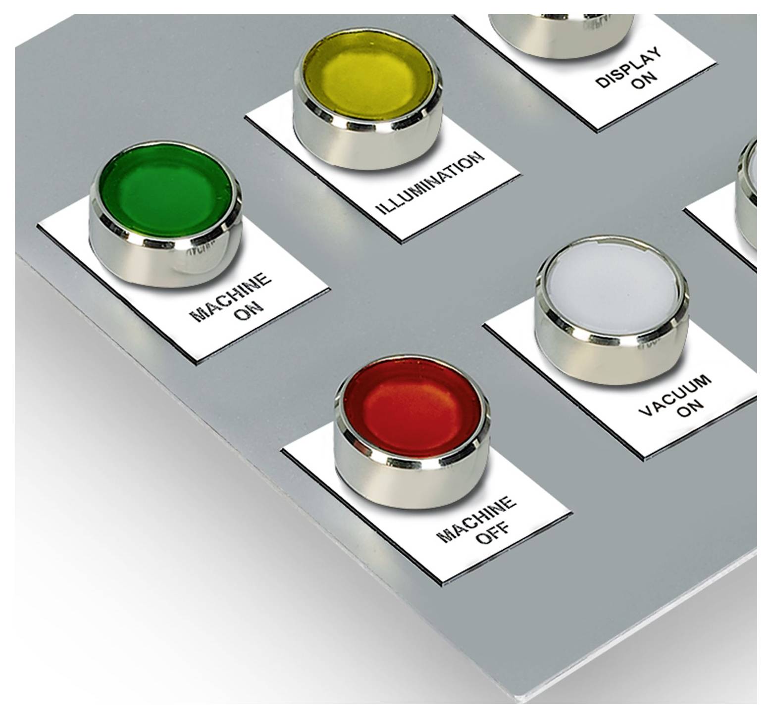 Control panel with four buttons labeled 'Machine On', 'Machine Off', 'Illumination', and 'Vacuum On'. Buttons are in green, red, yellow, and grey.