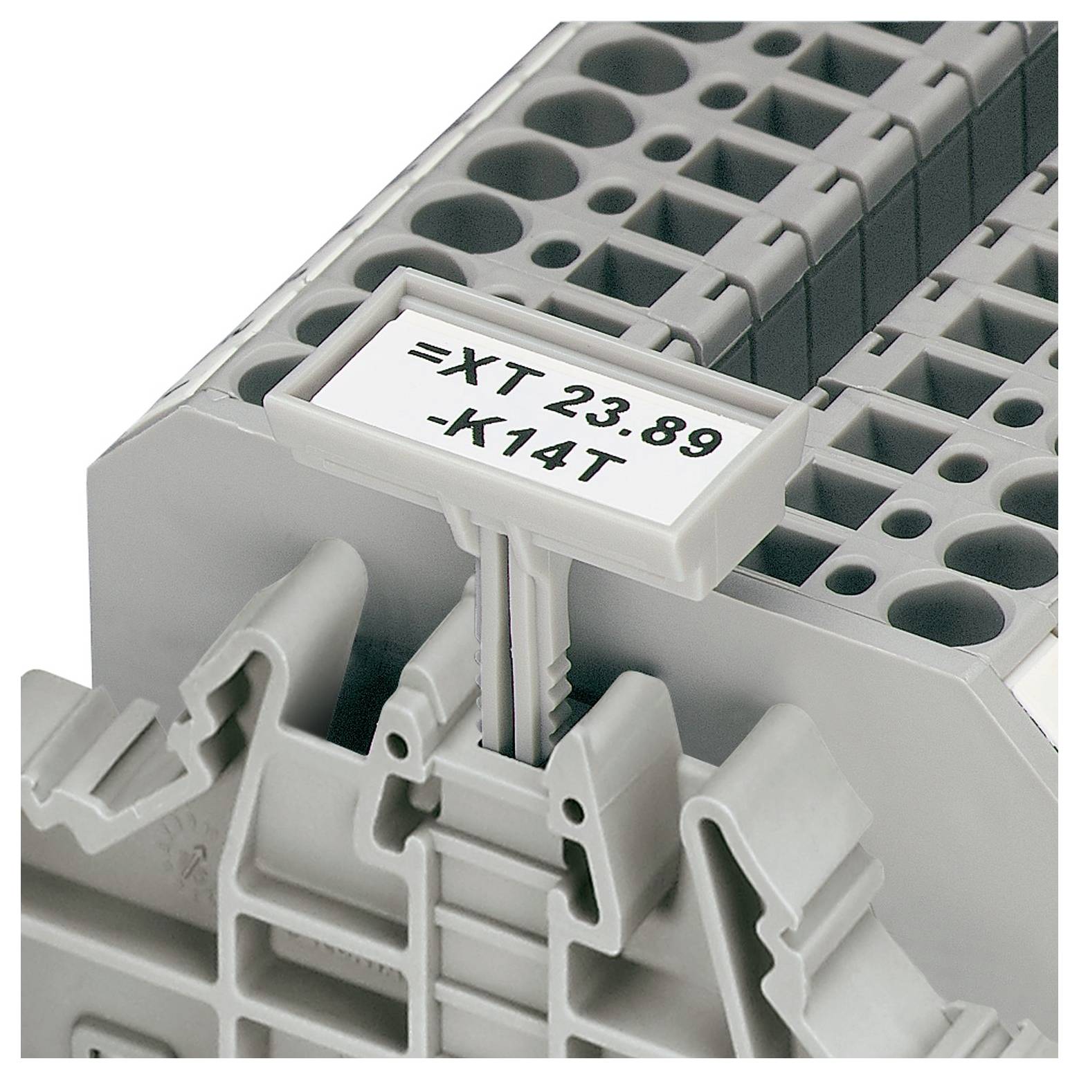 A gray terminal block with a label holder displaying '=XT 23.89 -K14T', used for electrical connections.