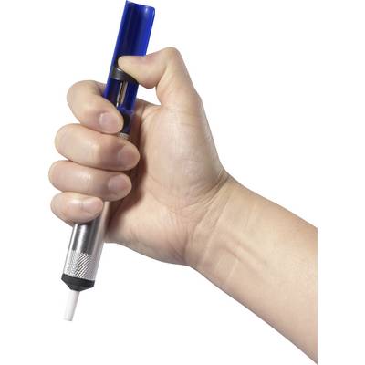 A hand is holding a desoldering pump with a blue handle. The pump is used to remove excess solder.