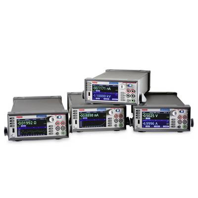 Four electronic measuring devices with digital displays are showing various measured values.