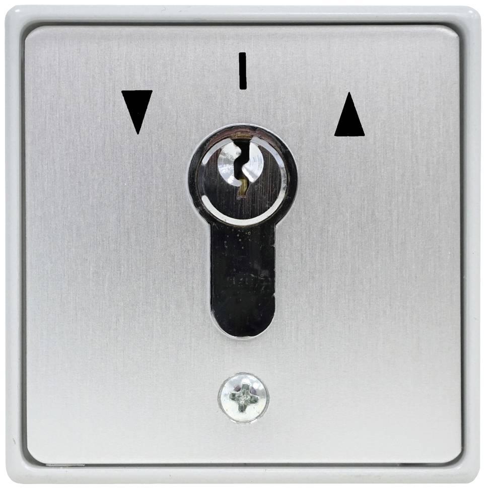 Three-symbol key switch: downward arrow, vertical line, upward arrow. Used for controlling devices.