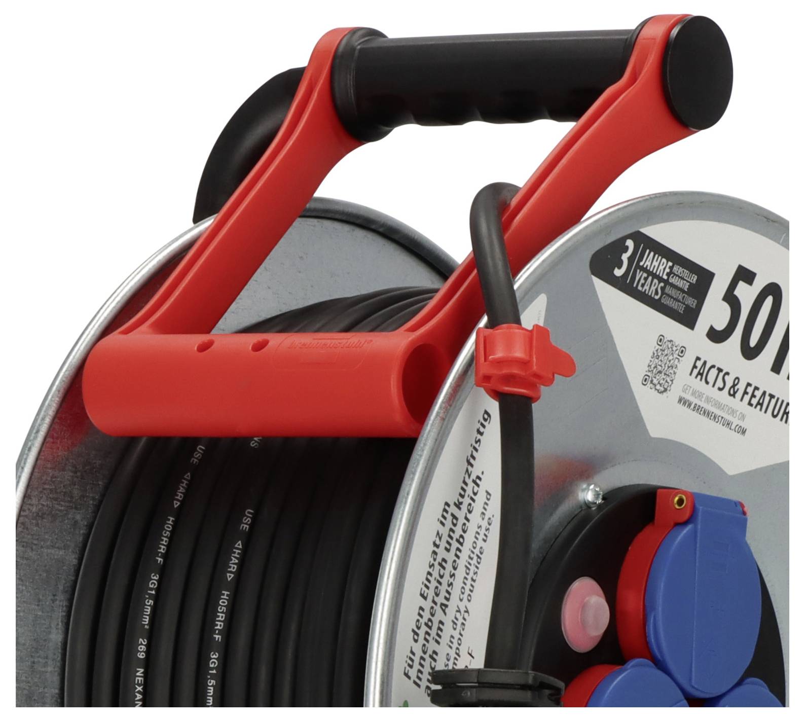 'Red handle on a gray cable reel with black cable and blue sockets'