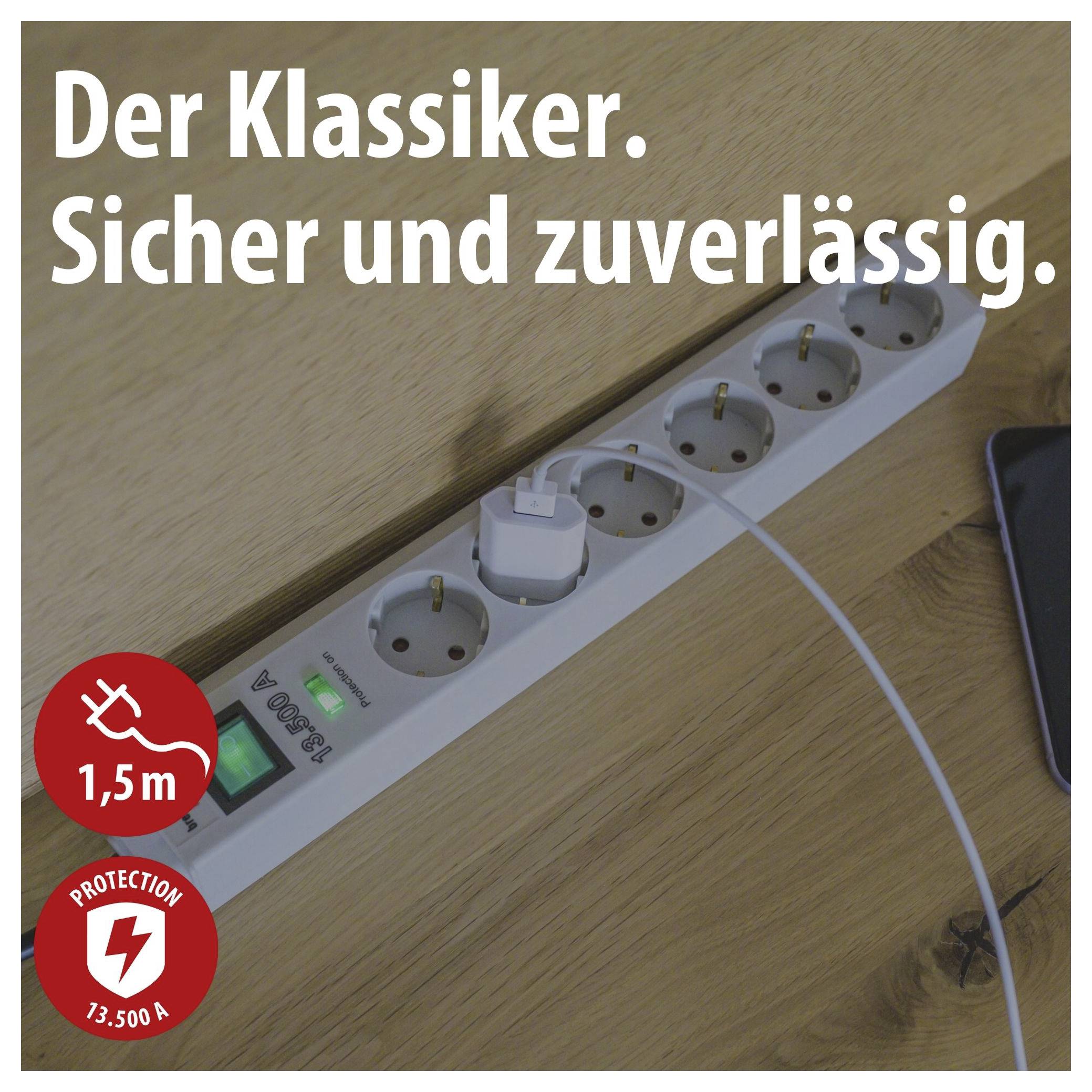 Power strip on wooden table with charging cable plugged in; text: 'The classic. Safe and reliable.'