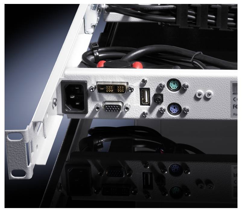 Back of an electronic device with ports: power, VGA, USB and round connectors for keyboard and mouse. Cables connected.