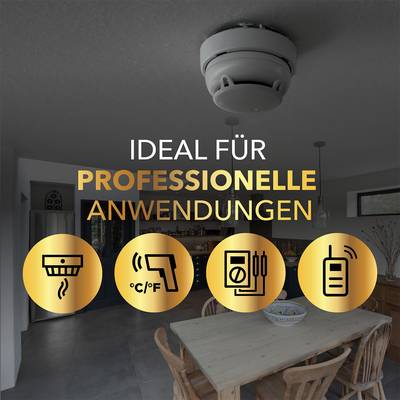 A smoke detector is installed on the ceiling of a modern kitchen. Text on the image says 'Ideal for professional applications'. Symbols show temperature and other operating modes.