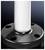 A white pipe inserted into a black, round metal base with four holes.