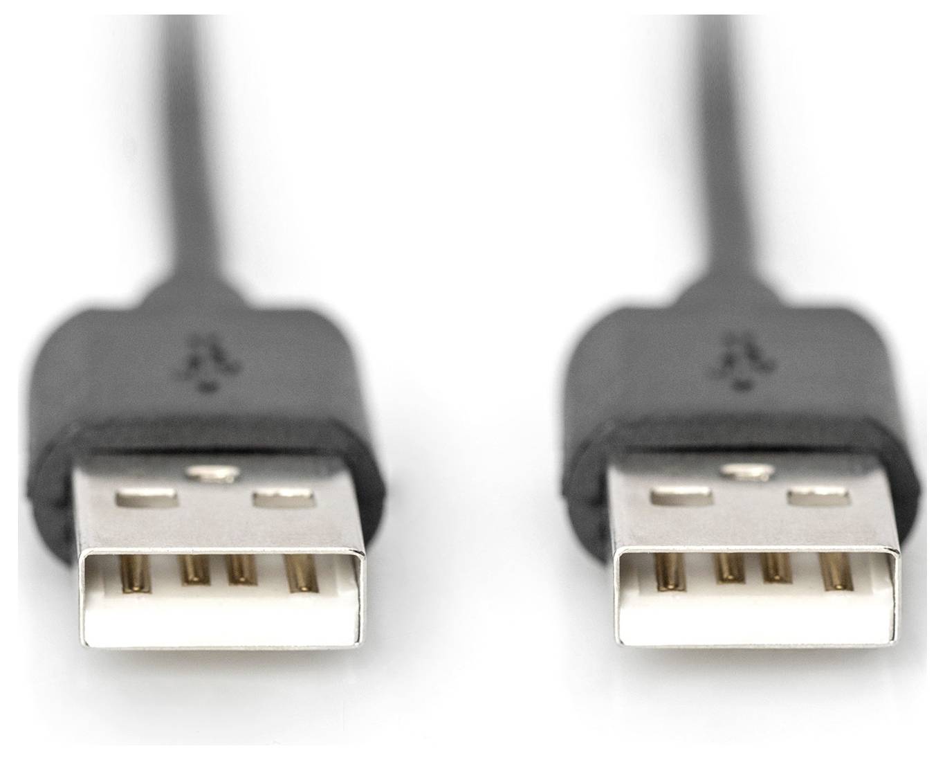 Two black USB plugs with rectangular metal connectors lie side by side, showing their contacts and are slightly blurred in the background.