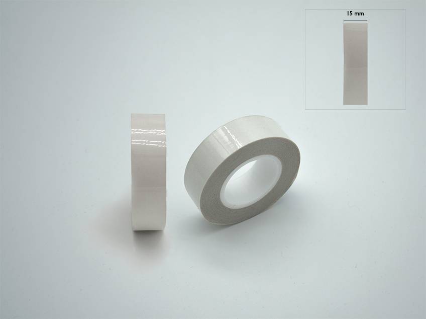 Two rolls of transparent adhesive tape against a grey background, one standing, one lying down. Top right: Segment showing '15 mm'.