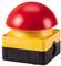 A large, red emergency stop button mounted on a yellow and black base.