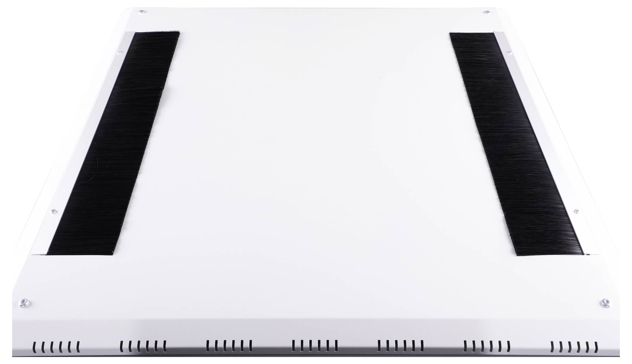 A white rectangular device with black brush strips on both sides. It has ventilation slots along the bottom edge.