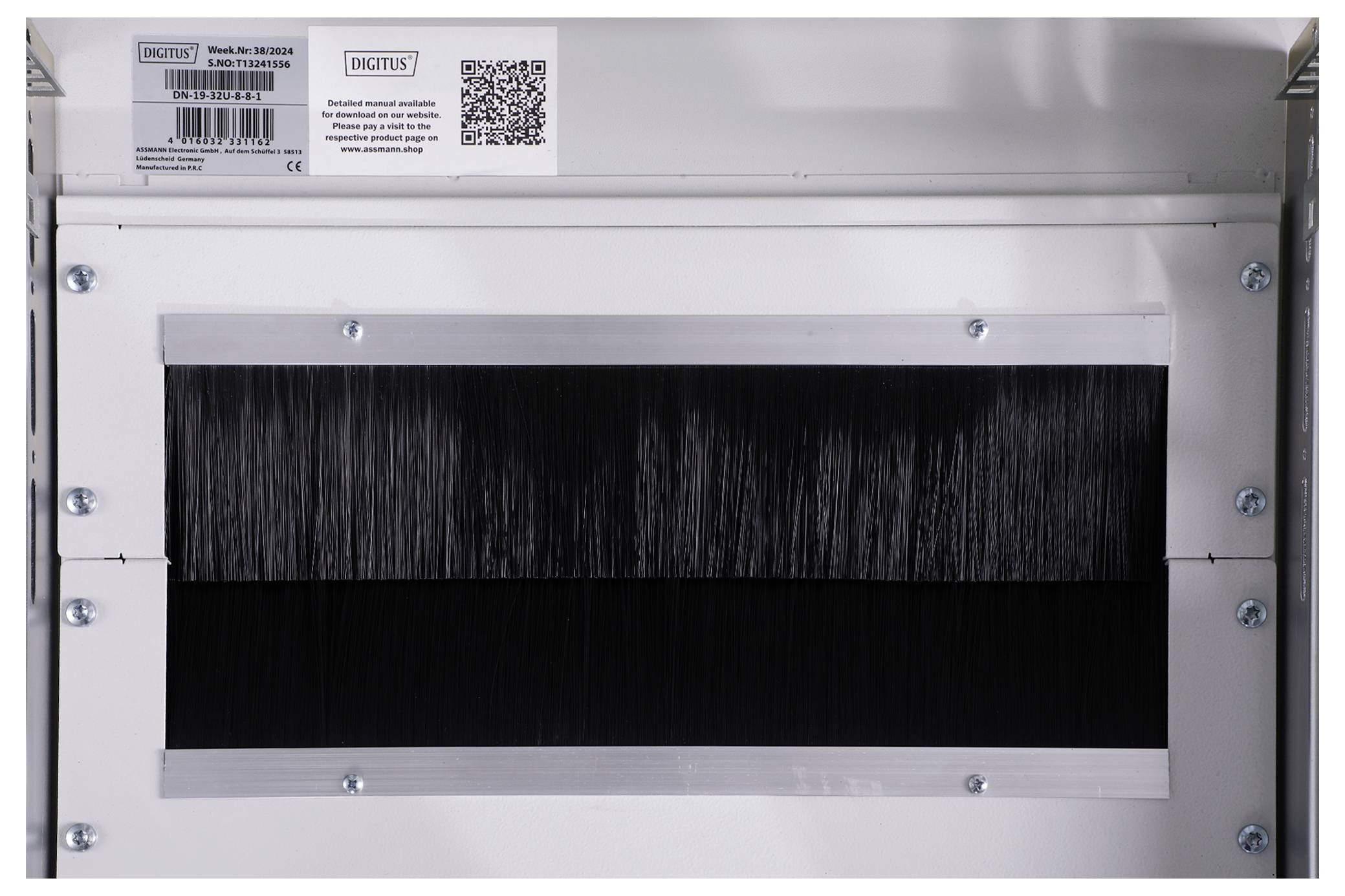 Metal casing with brush cable entry and multiple screw connections, suitable for cable management in technical environments.