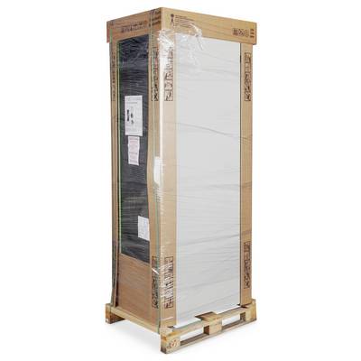 A large wardrobe cardboard packaging wrapped in plastic film, standing on a pallet.