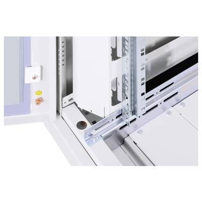 A technical detail of an electrical cabinet is shown, with rails and mechanical connecting elements.