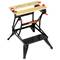 Compact, black workbench stand with two wooden boards and red clamps, suitable for DIY projects and workshop tasks.