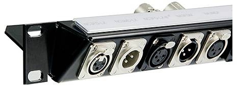 'A rack-mounted audio panel with multiple XLR connectors.'