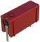 A red electronic component with metal pins on its underside, likely a resistor or capacitor for printed circuit board mounting.
