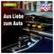 Interior of a car with a modern dashboard and automatic transmission. Text: 'Out of love for the car'. Logo: 'Liqui Moly'.