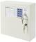 A white key cabinet with an integrated combination lock and two inserted keys. Keypad with blue buttons and display.