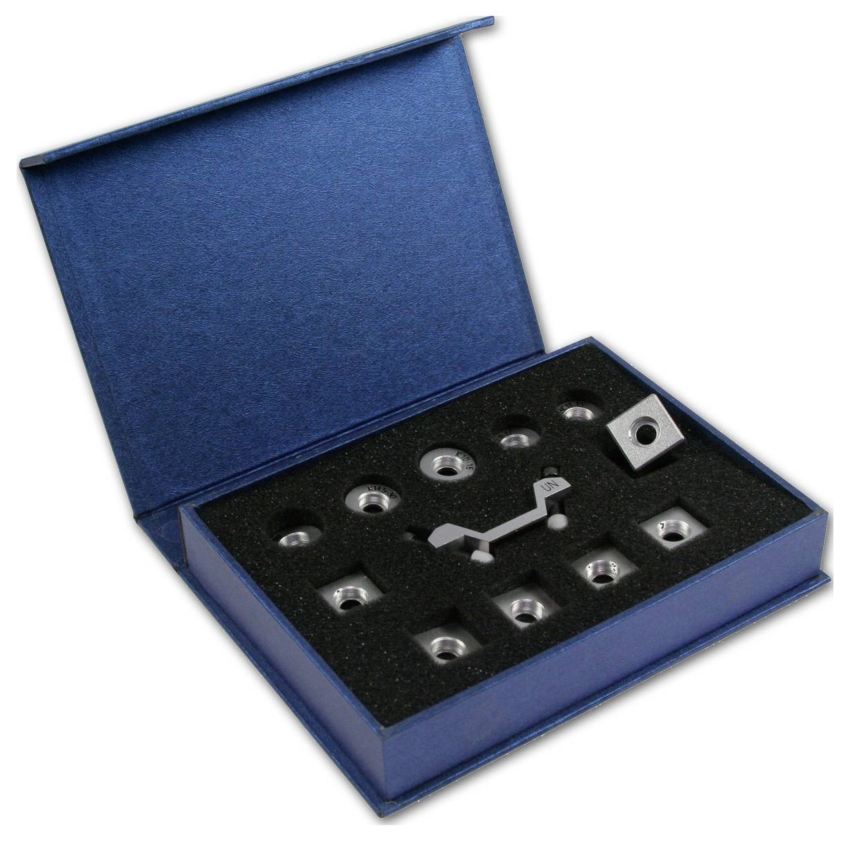 Blue box with foam lining, contains nine silver hexagonal nuts and a white tool adapter.