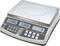 Electronic scales with a digital display, showing weight indication in kilograms. Buttons for tare function and unit adjustment available.