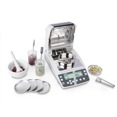 'Moisture analyser with digital display and multiple sample containers.'