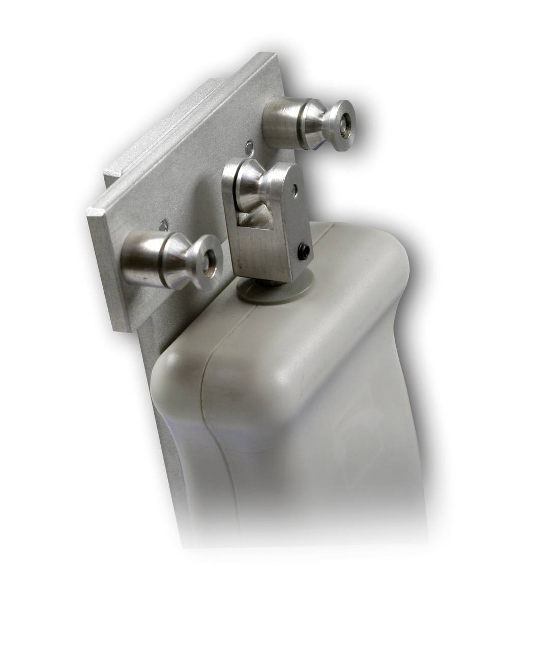 A grey, rectangular device with two small metal rollers on the front is attached to a flat, vertical metal plate.