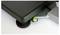 A spirit level on a dark surface shows the evenness by an air bubble that rests in the centre of the circular glass.