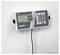 Wall-mounted digital scales display with a screen showing '0.0 kg'. Buttons for taring and weight storage.