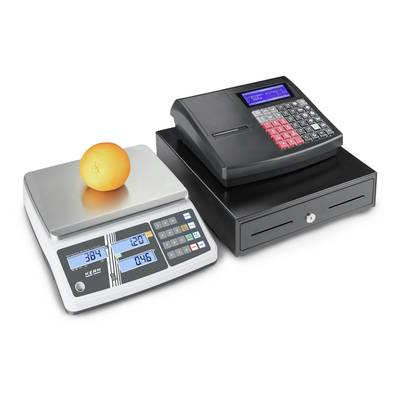 'Kitchen scales with an orange placed on top and an electronic till side by side. The scales display weight and price.'