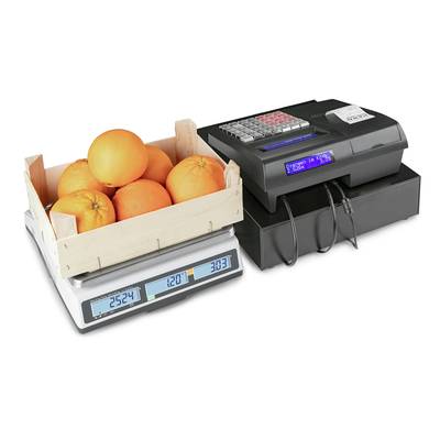 'A wooden crate of oranges on a digital scale, next to a till with a visible display and receipt printout.'