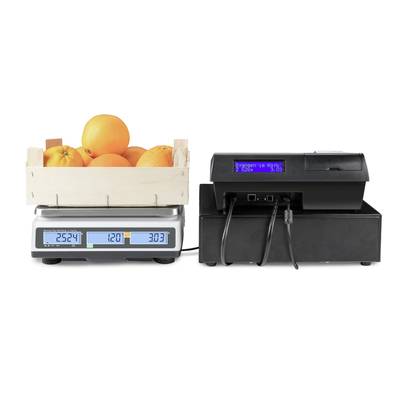 Wooden crate full of oranges on a digital scale displaying weight and price. Connected device with screen showing text.