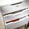 An open cupboard with three labelled drawers: top drawer 'Files', middle drawer 'Invoices', bottom drawer 'Office Supplies'.