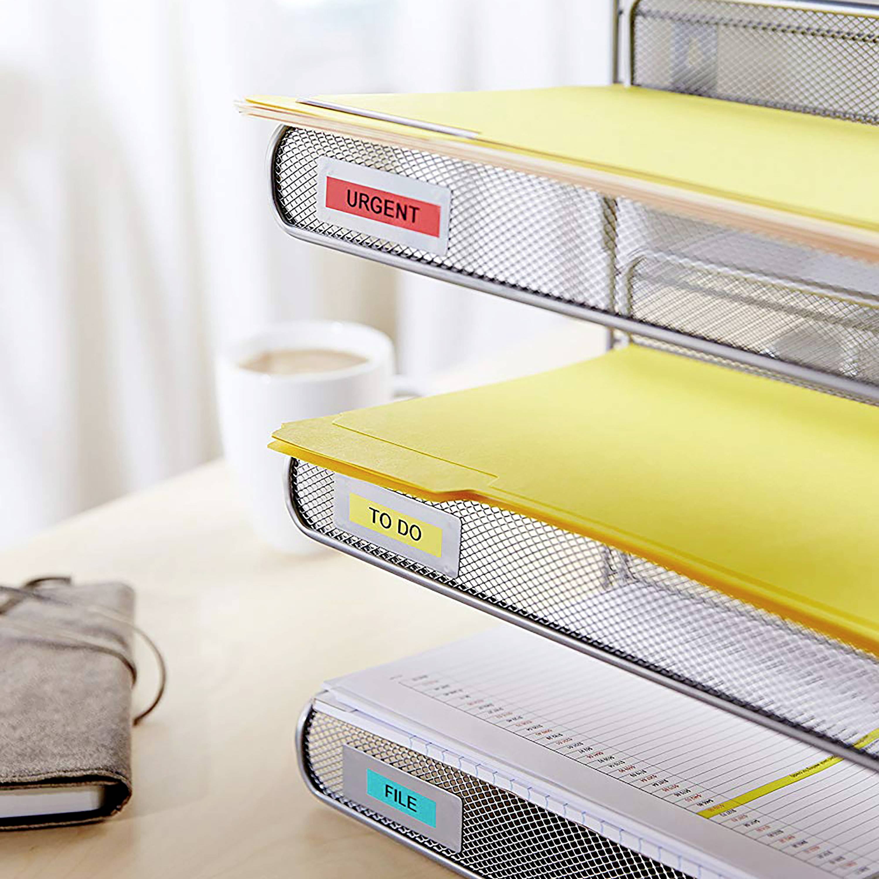 A three-part filing system labelled 'URGENT', 'TO DO' and 'FILE'. A coffee sits beside it on the table.