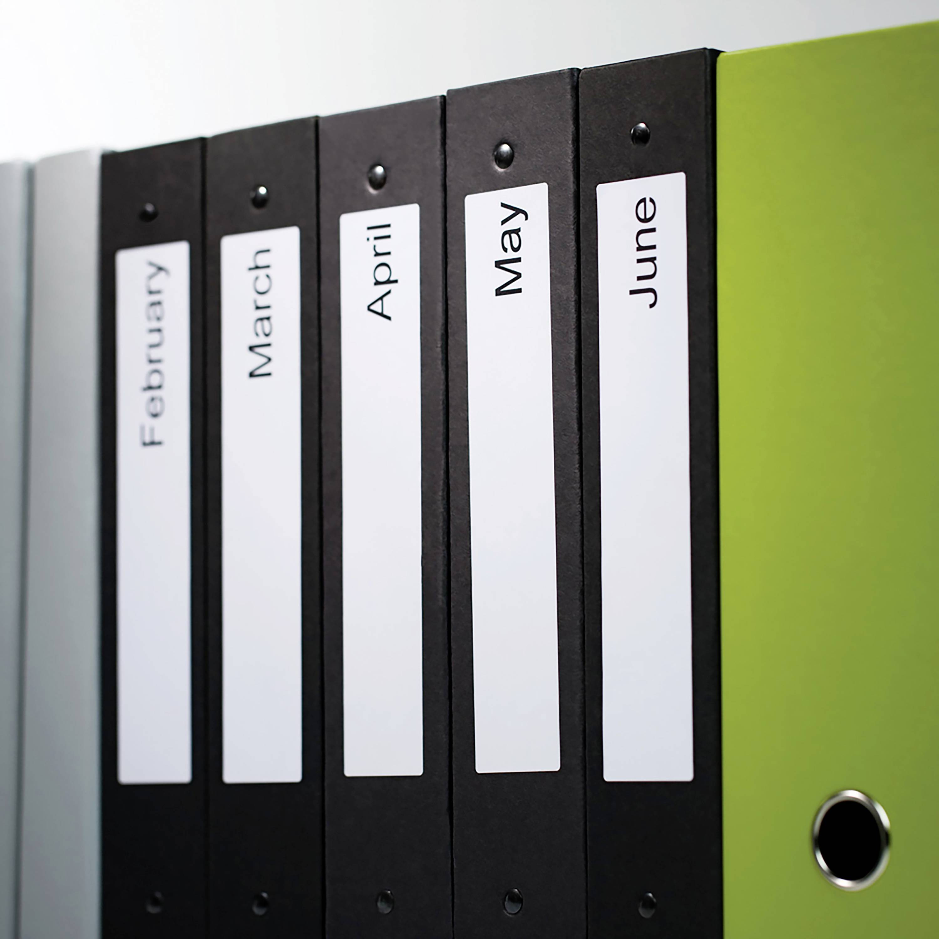 Folders in a shelf, labelled 'February', 'March', 'April', 'May', 'June', symbolise time flows or organisation.