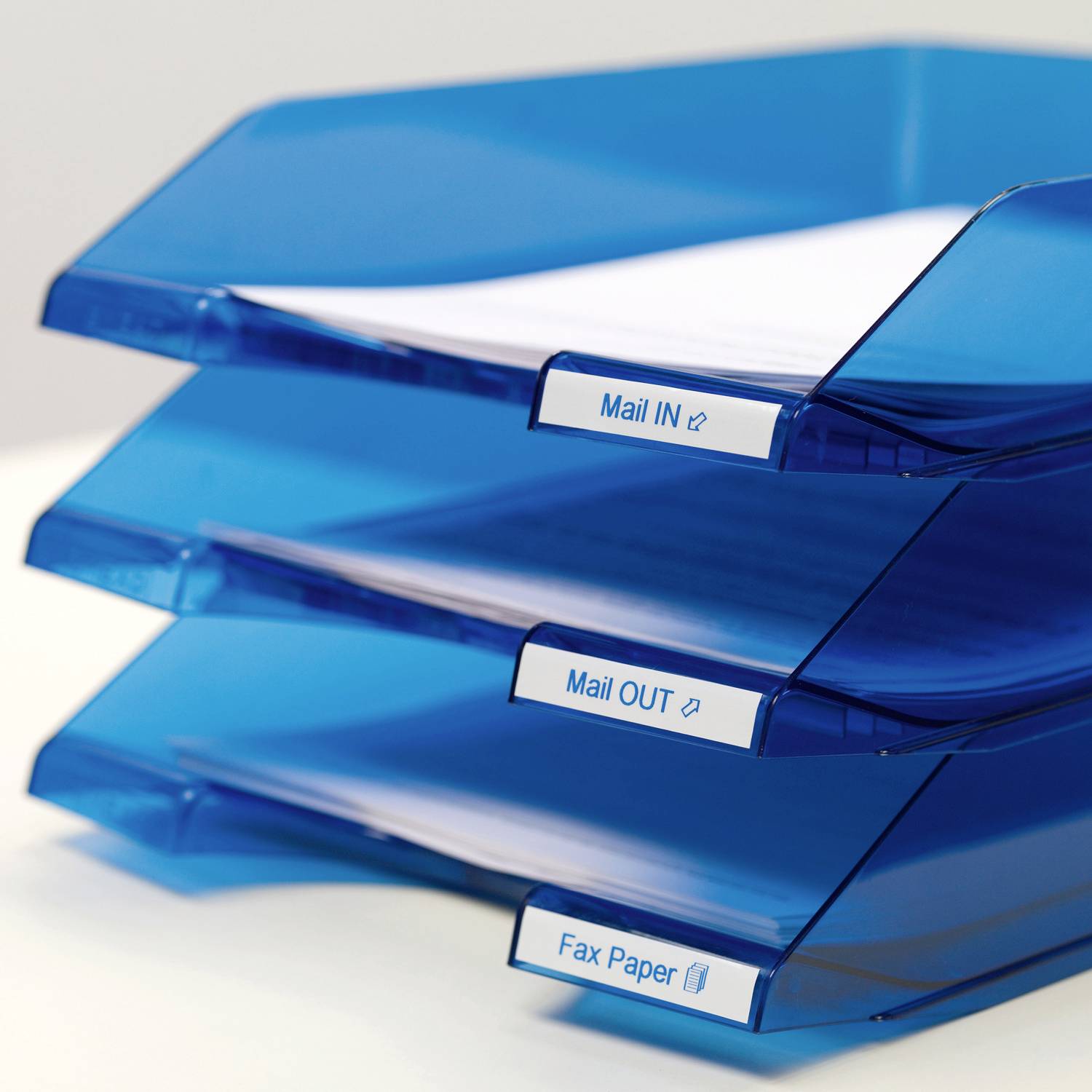 Three blue trays with papers, labelled 'Mail IN', 'Mail OUT' and 'Fax Paper', stacked on top of each other.